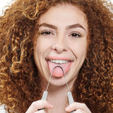 Person using Dr Tung's Copper Tongue Cleaner