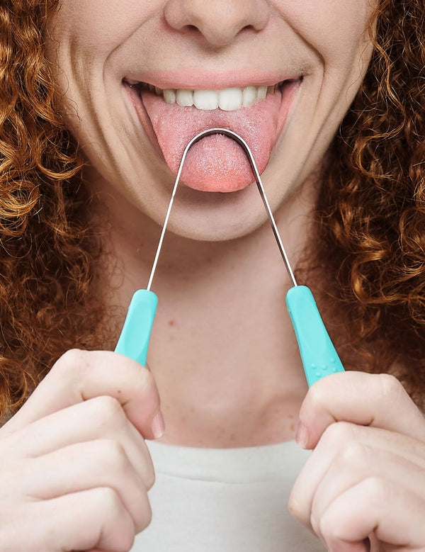 Person using Dr Tung's Stainless Steel Tongue Cleaner