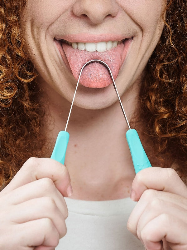 Person using Dr Tung's Stainless Steel Tongue Cleaner