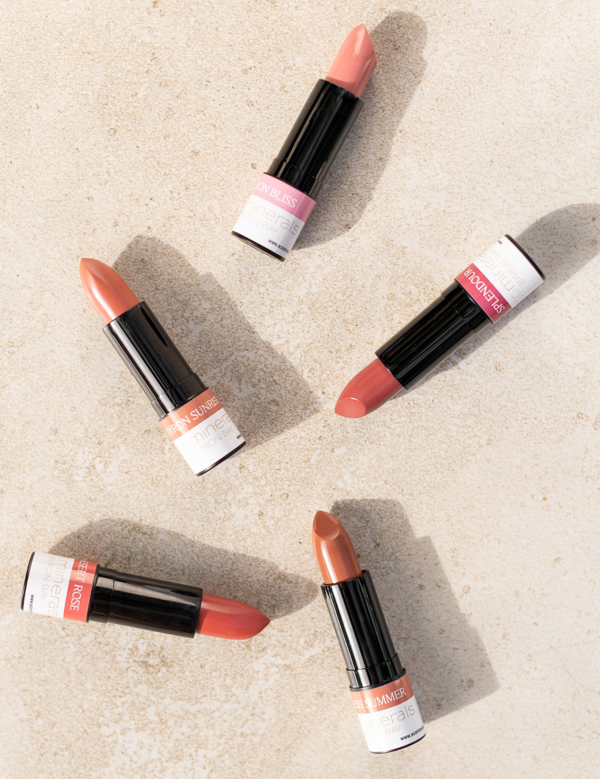 Eco Minerals lipsticks arranged on a stone surface