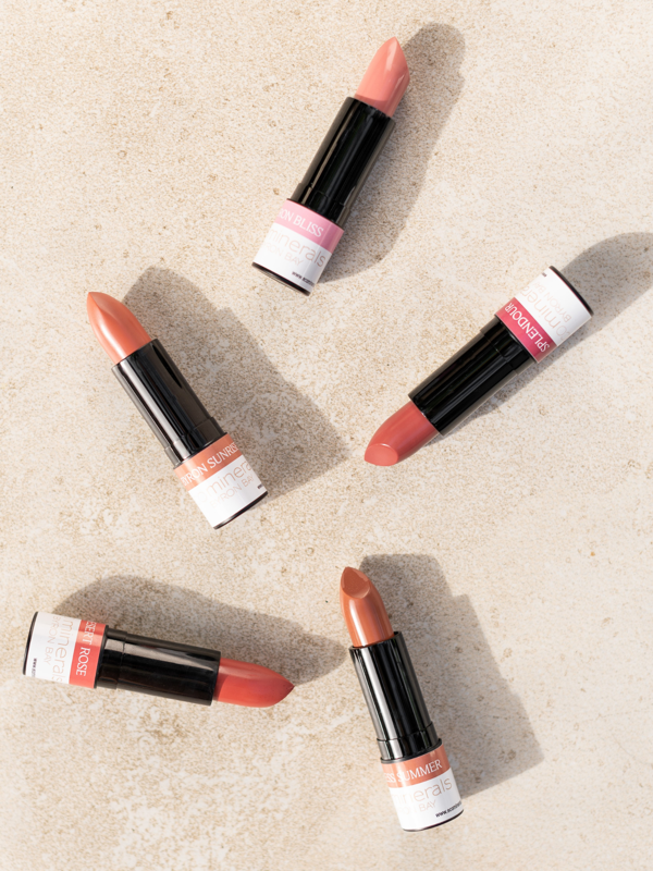 Eco Minerals lipsticks arranged on a stone surface