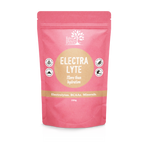 Coral-pink Eden Healthfoods Electra-Lyte Watermelon and Berry pouch standing upright, with a tan circular title panel, white lettering and four small black-and-white symbols.