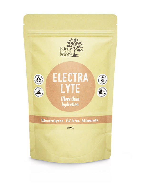 Pale yellow Eden Healthfoods Electra-Lyte Pineapple and Apple pouch standing upright, with a tan circular title panel and a horizontal band reading Electrolytes, BCAAs, Minerals.