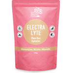 Coral-pink Eden Healthfoods Electra-Lyte Watermelon and Berry pouch standing upright, with a tan circular title panel, white lettering and four small black-and-white symbols.