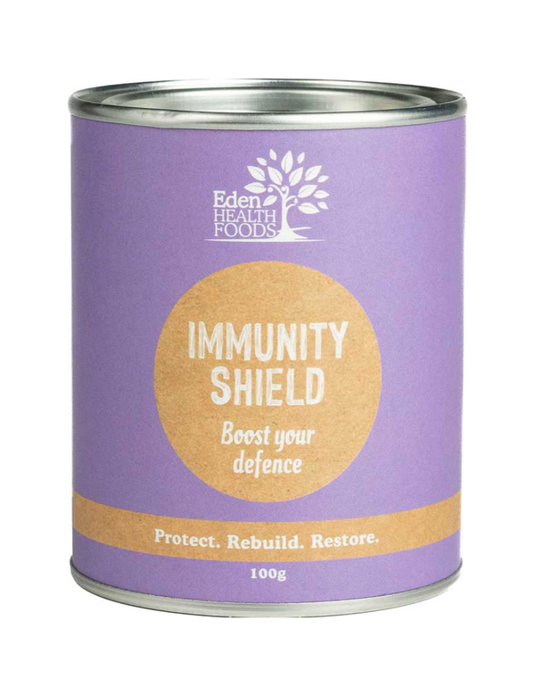 Eden Healthfoods Immunity Shield in a purple cylindrical tin with silver rims, white lettering and a tan circular title panel.