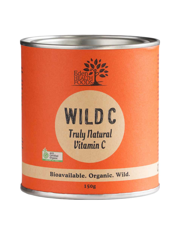 Eden Healthfoods Wild C vitamin C powder in an orange cylindrical tin with silver rims, a tan circular label and black lettering.