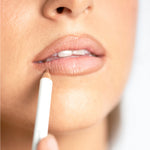 Model applying Ere Perez Acai Lip Pencil for a softly defined natural lip
