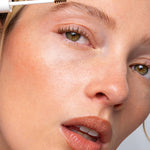 Model applying Ere Perez Argan Brow Hero to create naturally groomed brows