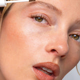 Model applying Ere Perez Argan Brow Hero to create naturally groomed brows