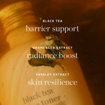 Ere Perez Black Tea Face Toner ingredient graphic over amber tea and botanicals, highlighting black tea for barrier support, grape seed extract for radiance and parsley extract for skin resilience.