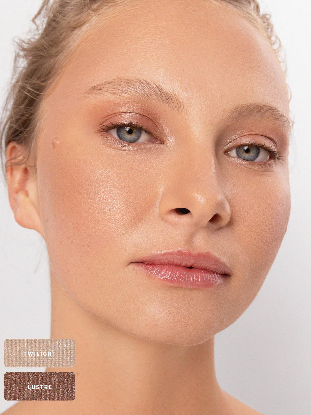 Blonde model wearing a soft pearly and bronze eye look from the Ere Perez Light Shimmer palette, with Twilight and Lustre shade swatches at the lower left.