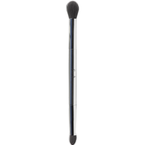 Ere Perez Eco Vegan Eye Duo Brush standing upright on white, with a polished silver handle, a large rounded blending head and a smaller tapered detail head.
