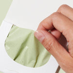Ere Perez Green Tea Oil Control Paper – blotting paper removed from its envelope