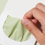 Ere Perez Green Tea Oil Control Paper – blotting paper removed from its envelope