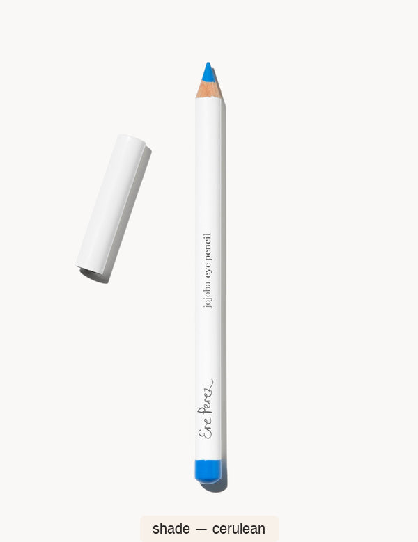 White Ere Perez Jojoba Eye Pencil in Cerulean, with an exposed bright blue tip, a matching blue end cap and its white lid beside it; the shade name appears below.
