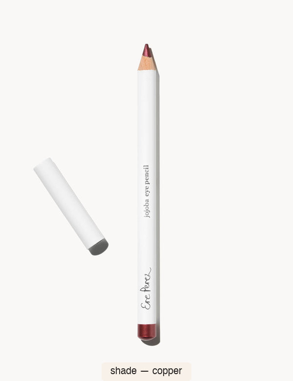 White Ere Perez Jojoba Eye Pencil in Copper, with an exposed reddish-brown tip, a matching burgundy-brown end cap and its white lid beside it; the shade name appears below.