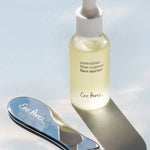 Ere Perez Self-Care Duo – face nectar and steel face tool in sunlight