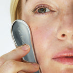 Ere Perez Self-Care Duo – steel face tool used on the cheek