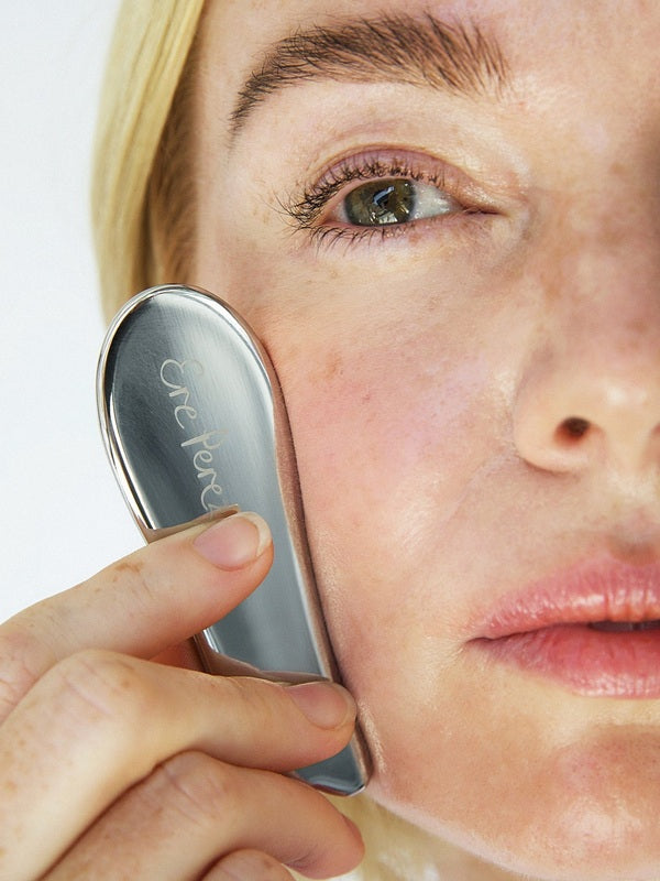 Ere Perez Self-Care Duo – steel face tool used on the cheek