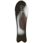 The Ere Perez Steel Face Tool is a shiny, curved stainless steel gua sha with "Ere Perez" etched on it. Designed with smooth edges and a rounded, flared base for effective facial massage. Displayed on a white background.