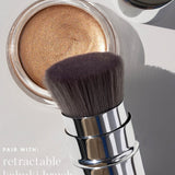 Ere Perez Vanilla Highlighter Balm – Sun Halo highlighter styled with a makeup brush