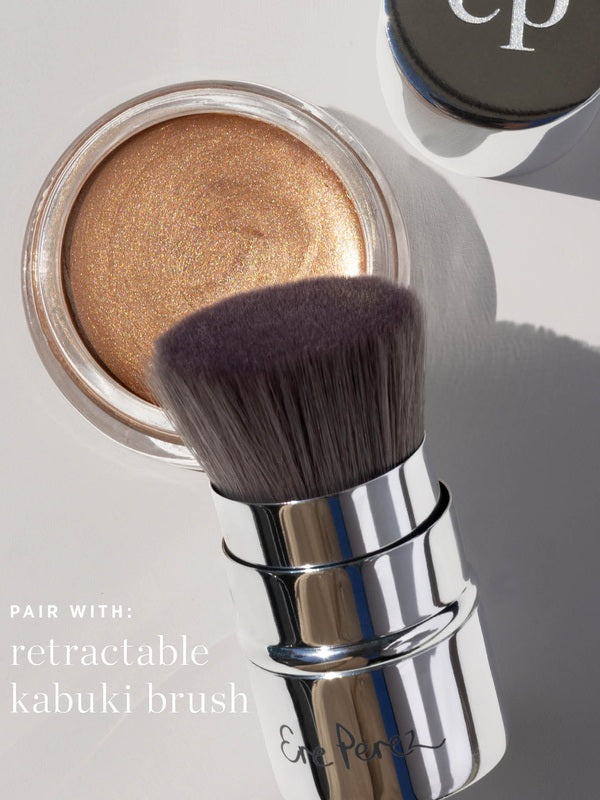 Ere Perez Vanilla Highlighter Balm – Sun Halo highlighter styled with a makeup brush