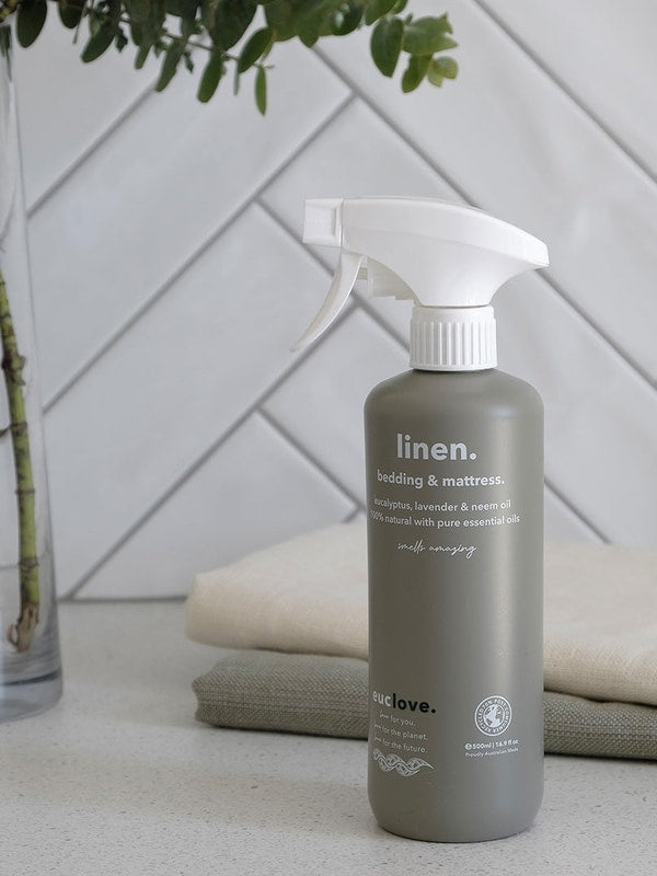 Euclove Linen Spray styled with linen and eucalyptus