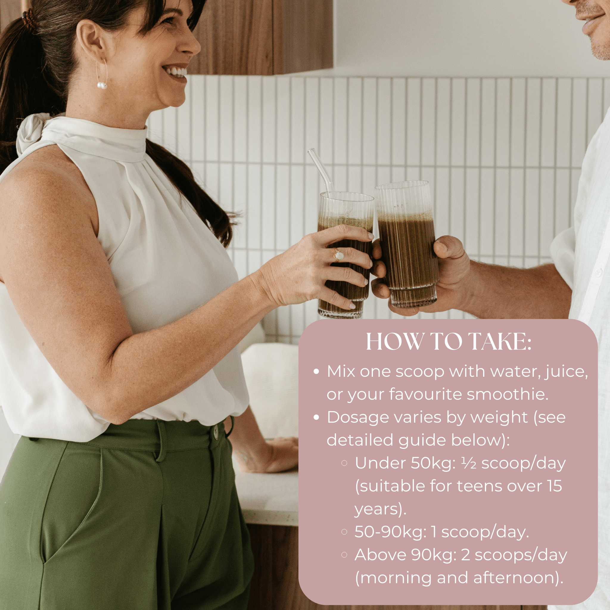 Woman smiling and drinking Fem21 in a kitchen with another person