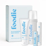 Vanessa Megan Foodie Blue Raspberry four-piece Body Bundle: foaming body wash, body moisturiser, face and body mist, and lip balm standing with the matching gift box against a light background.