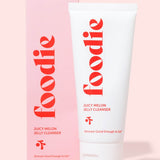 Vanessa Megan Foodie Juicy Melon Jelly Cleanser 75ml tube standing beside its matching pink carton on a pink surface.