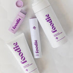 Vanessa Megan Foodie Passion Pop four-piece Body Bundle: foaming body wash, body moisturiser, face and body mist, and lip balm arranged on softly folded white fabric, with the lip balm open.