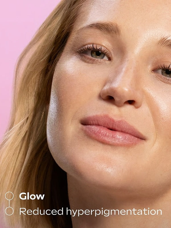 Model showing a glowing complexion after using Weleda Glow Perfecting Serum Booster Drops