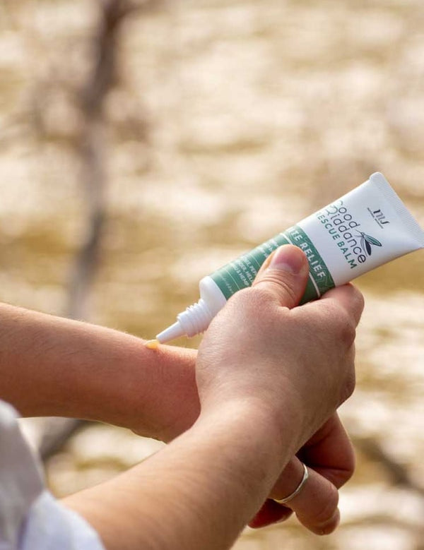 Good Riddance Rescue Balm being applied outdoors