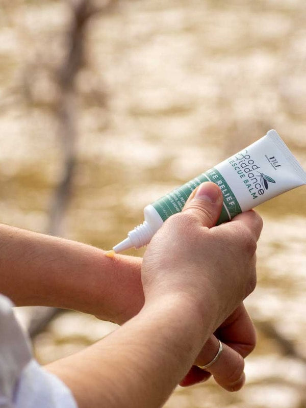 Good Riddance Rescue Balm being applied outdoors