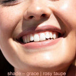 Close-up of a smiling person with text 'shade - grace | rosy taupe' at the bottom.