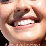 Close-up of a smiling person with text 'shade - grace | rosy taupe' at the bottom.