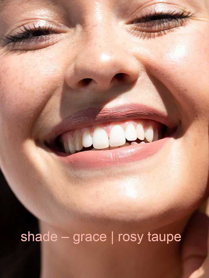 Close-up of a smiling person with text 'shade - grace | rosy taupe' at the bottom.