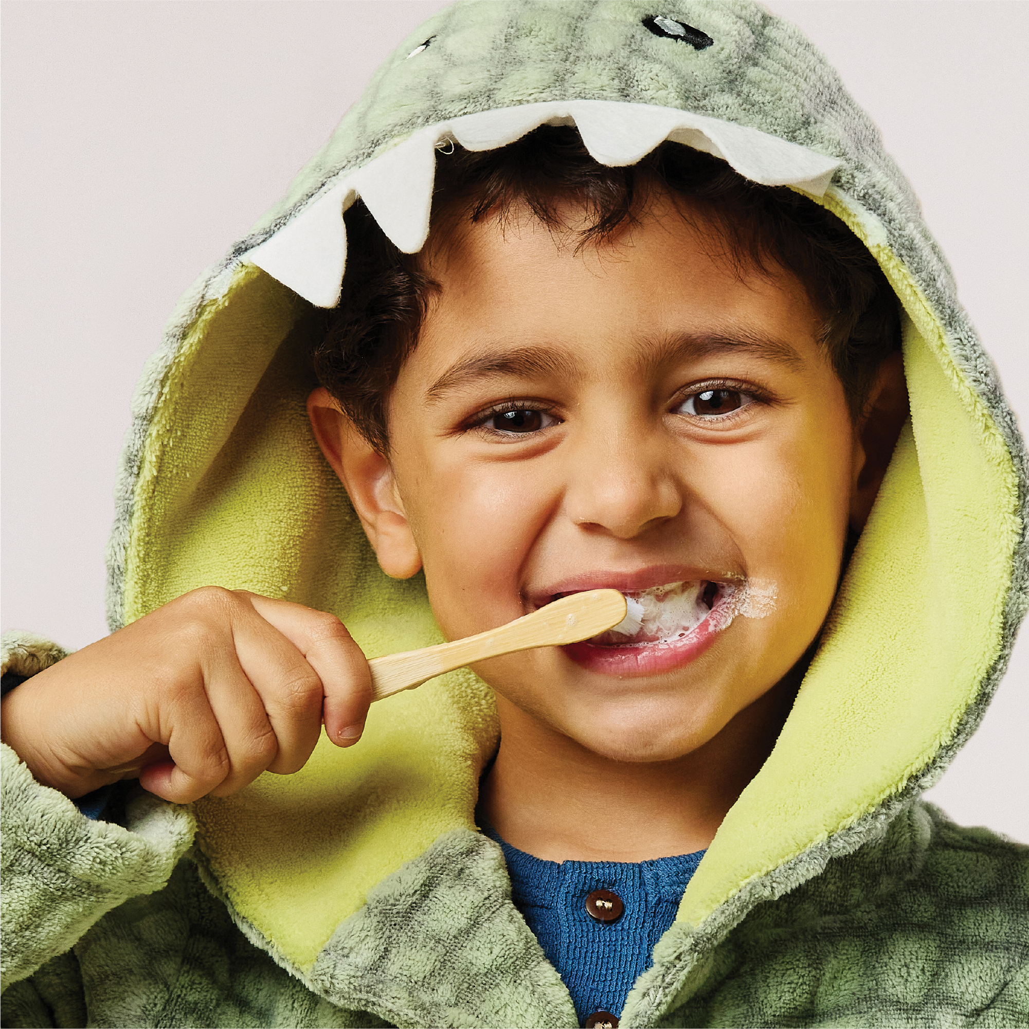 Child brushing with Grants Blueberry Burst Kids Toothpaste