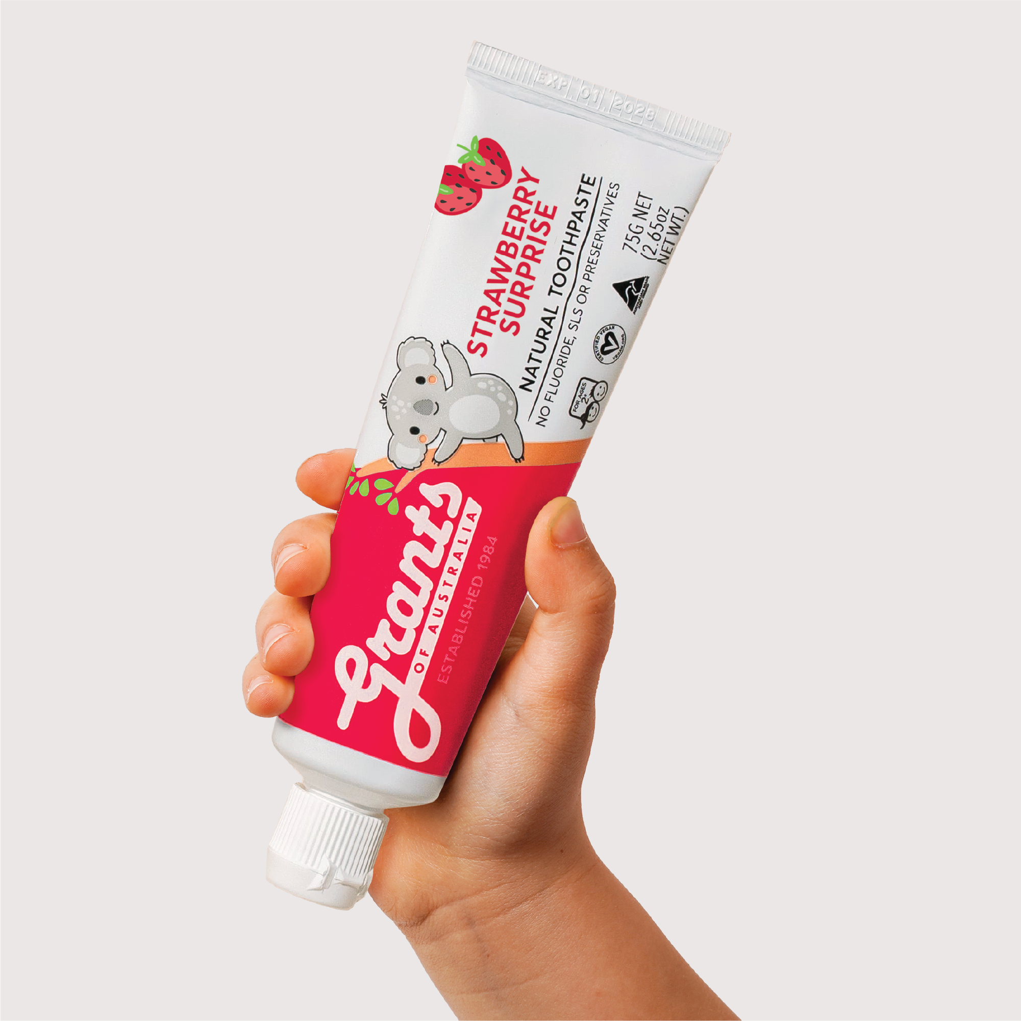 Grants Strawberry Surprise Kids Toothpaste held in hand