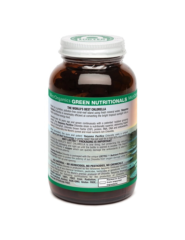 Side of an amber Green Nutritionals Yaeyama Pacifica Chlorella bottle, showing dense product information on a pale panel above a green band, beneath a silver screw lid.