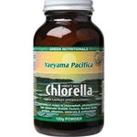 A 120g brown glass bottle of Green Nutritionals Yaeyama Pacifica Chlorella Powder features green and white text highlighting its chlorophyll-rich superfood benefits, with a scenic water background on the label.