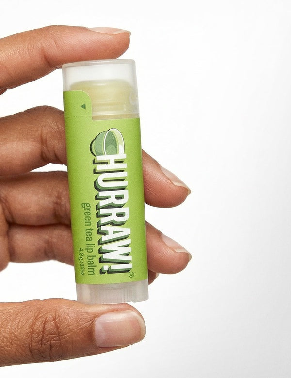 Hand holding Hurraw! Organic Lip Balm - Green Tea 4.8g