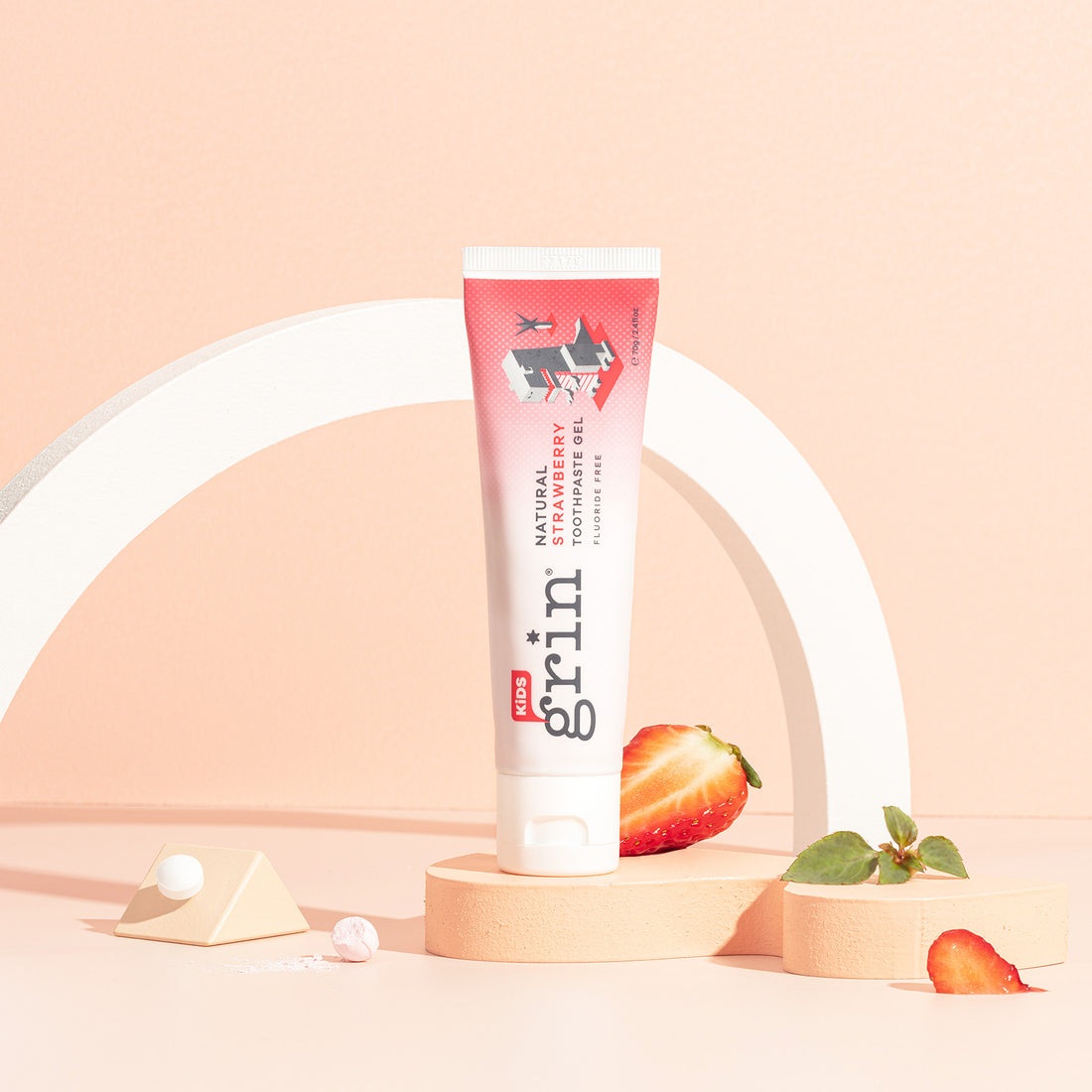 Grin Kids Strawberry Toothpaste styled with strawberries