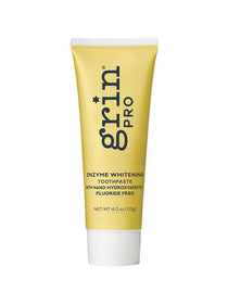 Yellow tube of grin Pro enzyme whitening toothpaste on a white background