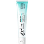 Grin Natural Freshening toothpaste tube with a turquoise-to-white gradient, black vertical Grin lettering and a white flip-top cap.