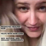 Video still of a blonde woman with text claiming HairOM promotes healthy hair, helps with hair loss, and contains 100% natural and organic ingredients.