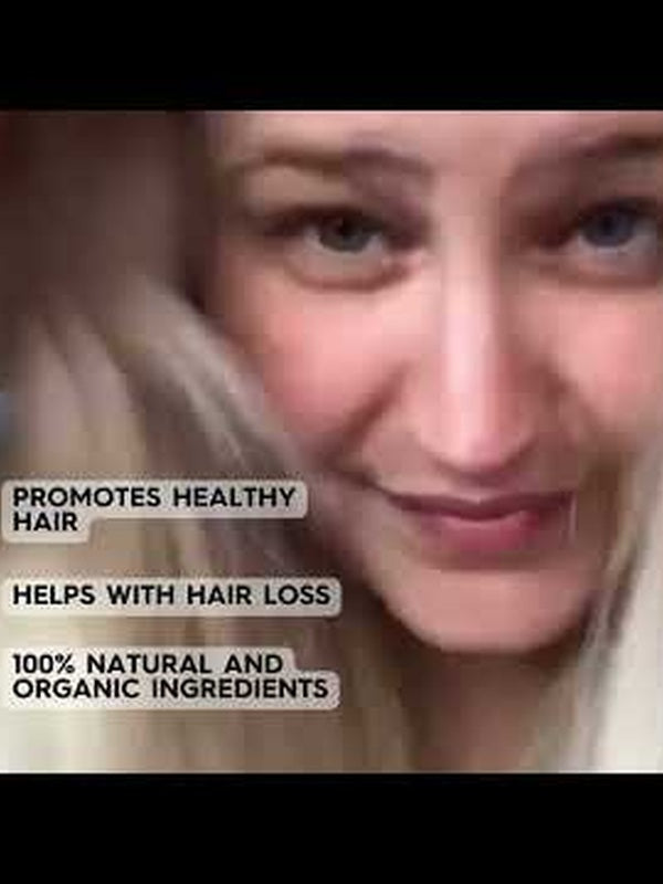 Video still of a blonde woman with text claiming HairOM promotes healthy hair, helps with hair loss, and contains 100% natural and organic ingredients.