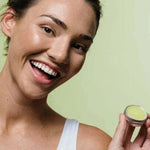 Botani Healing Lip Balm 10g — model holding healing lip balm
