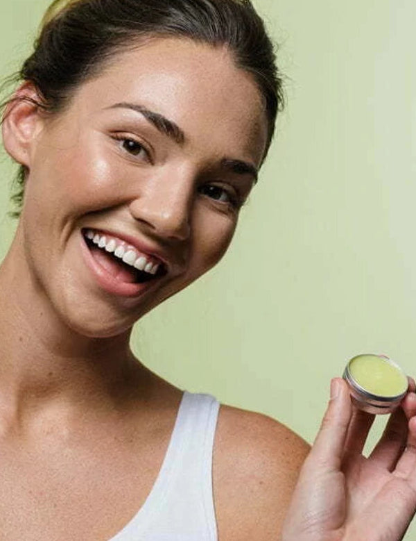Botani Healing Lip Balm 10g — model holding healing lip balm