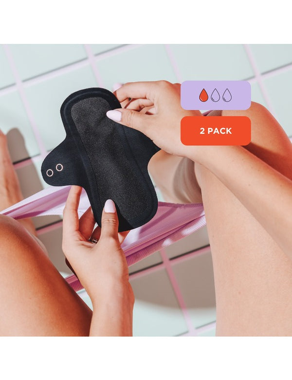 Hello Period reusable liner held in hand with absorbency details